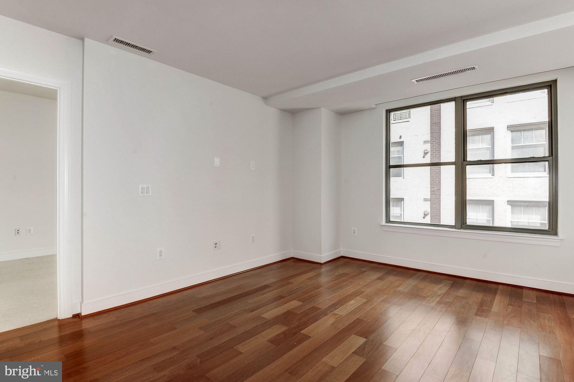 2425 L Street Northwest, Unit 635 Washington, DC 20037 - Photo 4 of 38 Living Room with Hardwood flooring