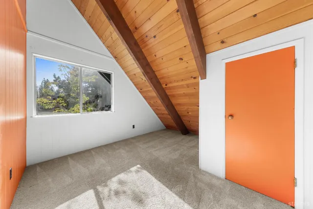 a view of a room with a large window