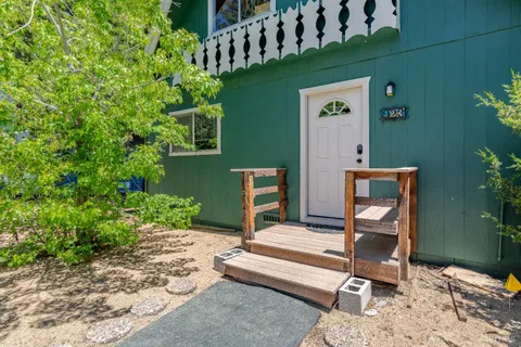 a backyard of a house with outdoor seating