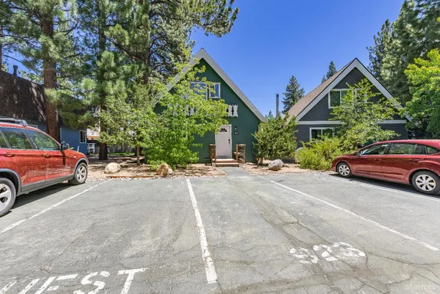 a view of a car parked in front of a house