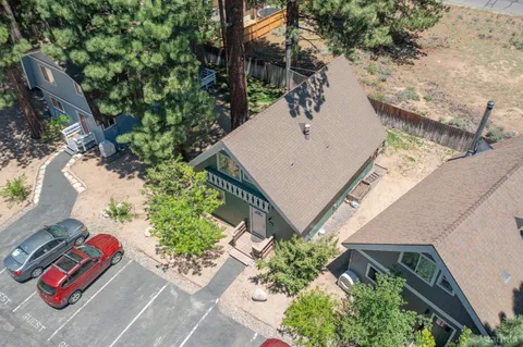 a front view of a house with wooden fence