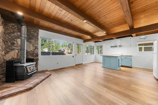a view of a livingroom with an empty space and a window