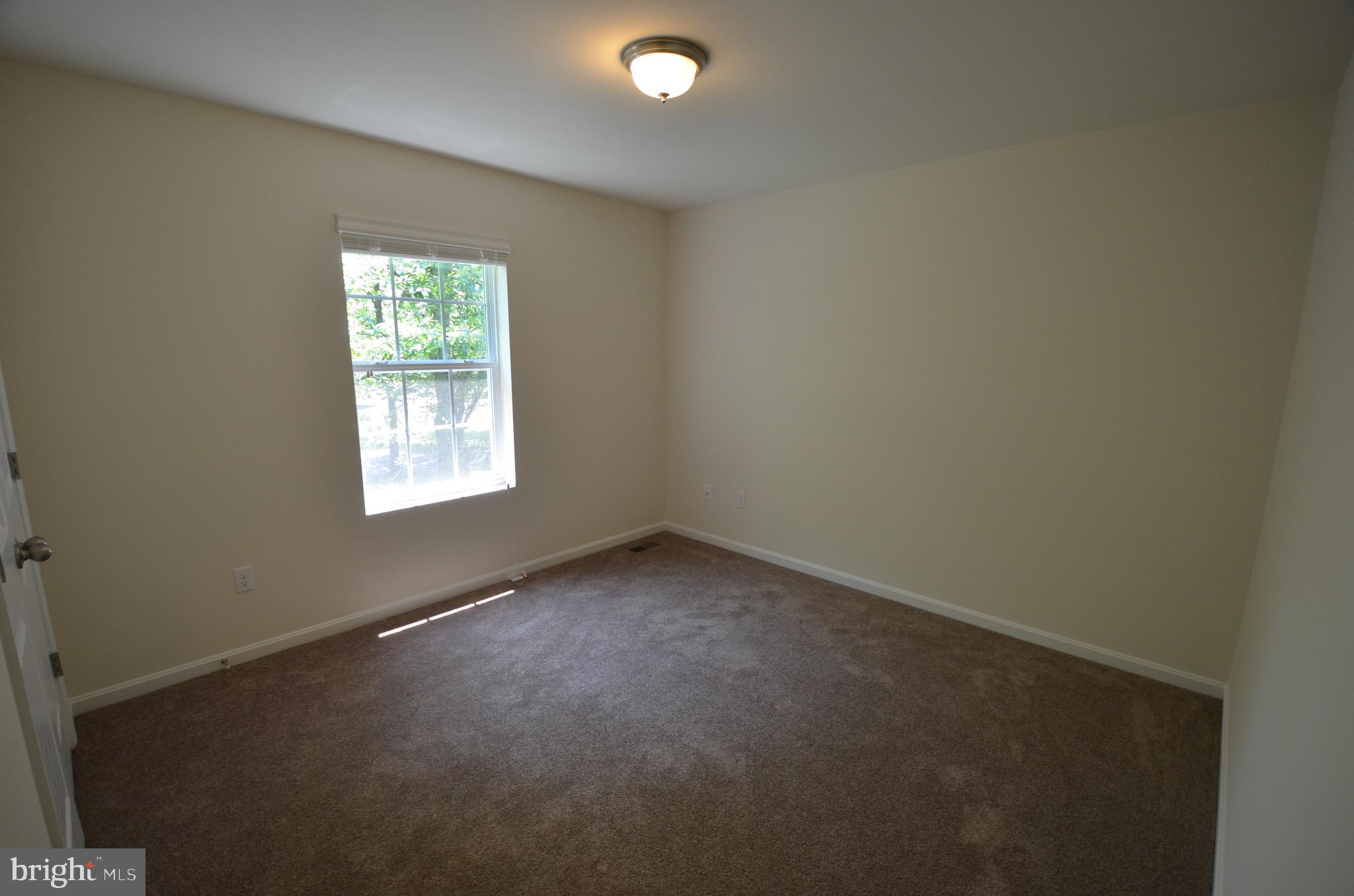 5917 Sneed Drive Deale, MD 20751 - Photo 12 of 26 an empty room with a window