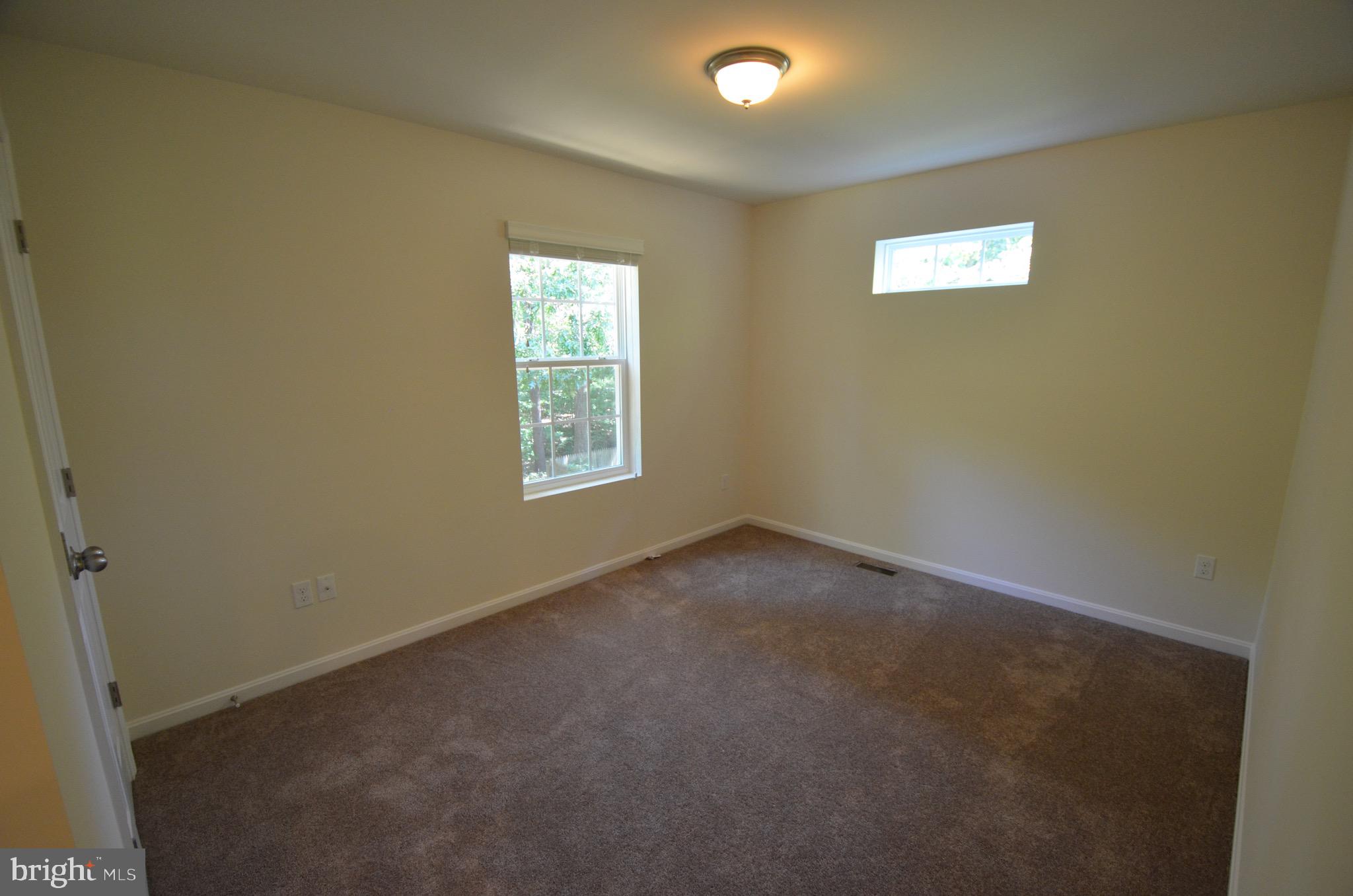 5917 Sneed Drive Deale, MD 20751 - Photo 15 of 26 an empty room with windows