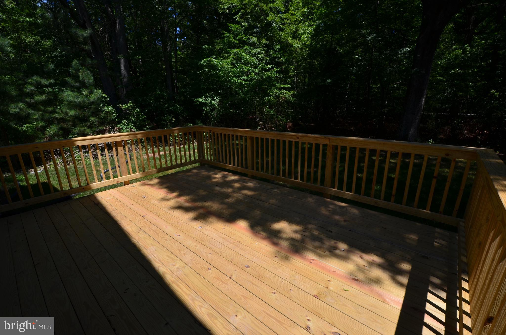 5917 Sneed Drive Deale, MD 20751 - Photo 25 of 26 a view of balcony with wooden floor and fence