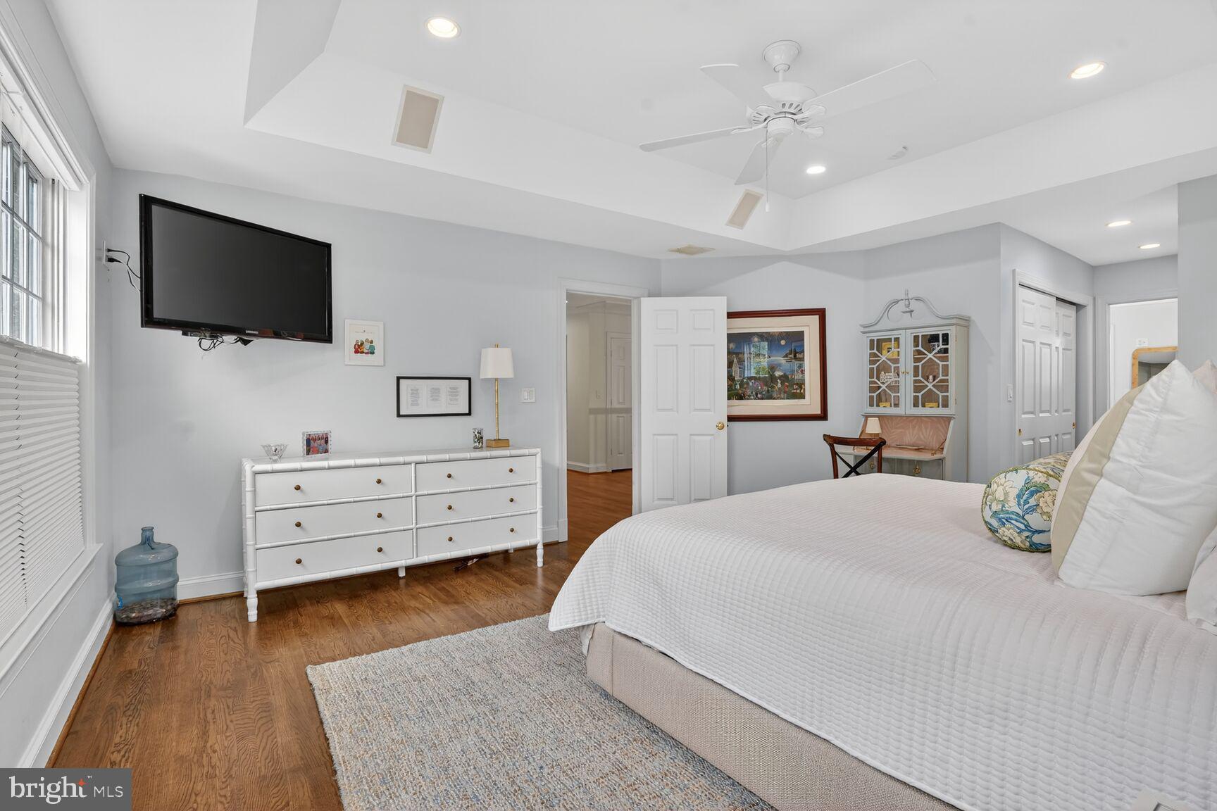 4837 W Street Northwest Washington, DC 20007 - Photo 26 of 51 a bed room with furniture and flat screen tv