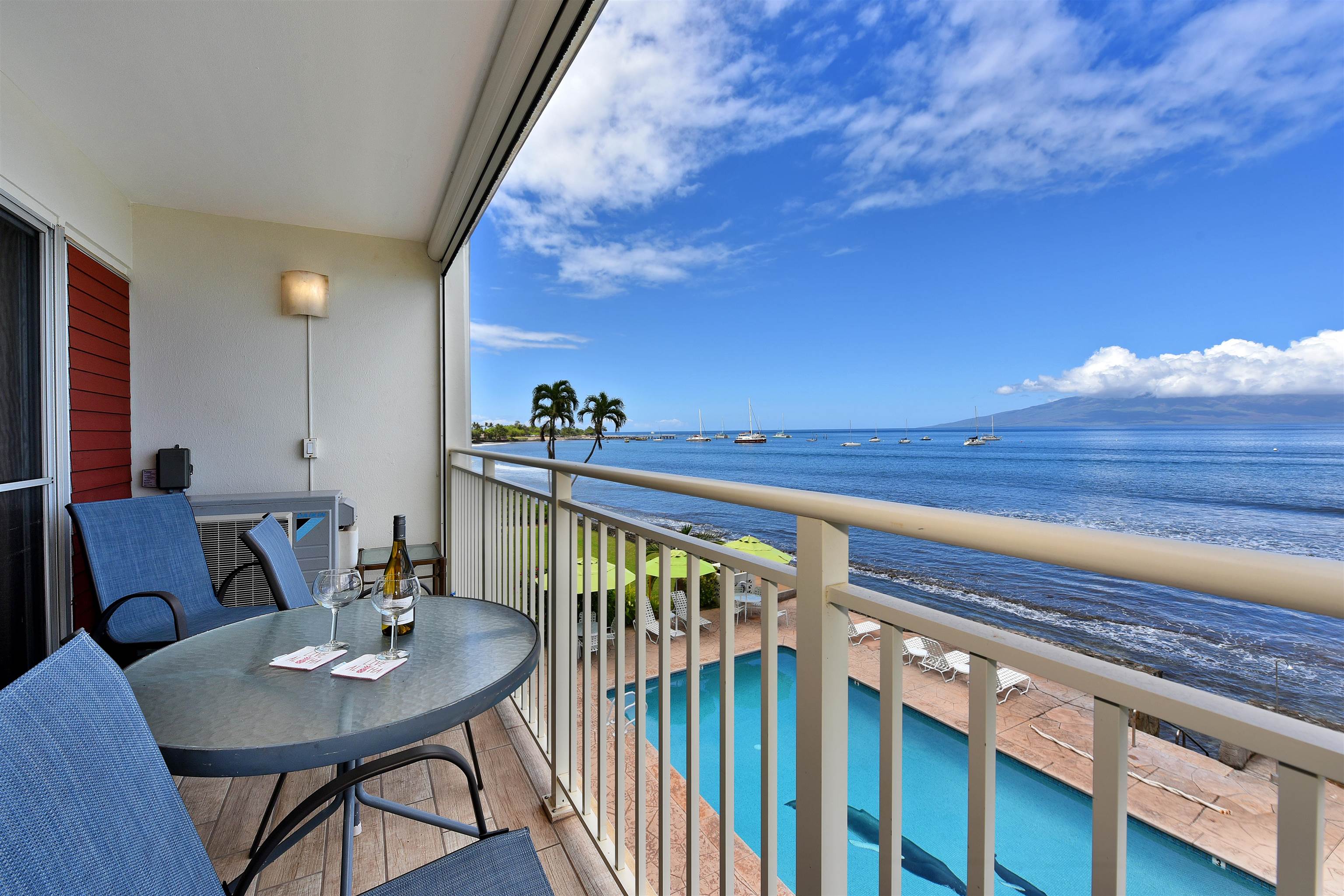 1403 Front Street, Unit 308 Lahaina, HI 96761 - Photo 1 of 35 a view of a dining room with furniture and wooden floor