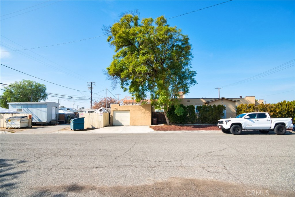584 East H Street, Unit 111 Colton, CA 92324 - Photo 16 of 18 a view of street with parked cars