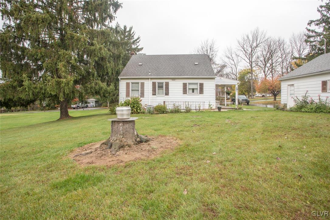 2014 Springtown Hill Road Hellertown, PA 18055 - Photo 22 of 22 a front view of a house with a garden and trees