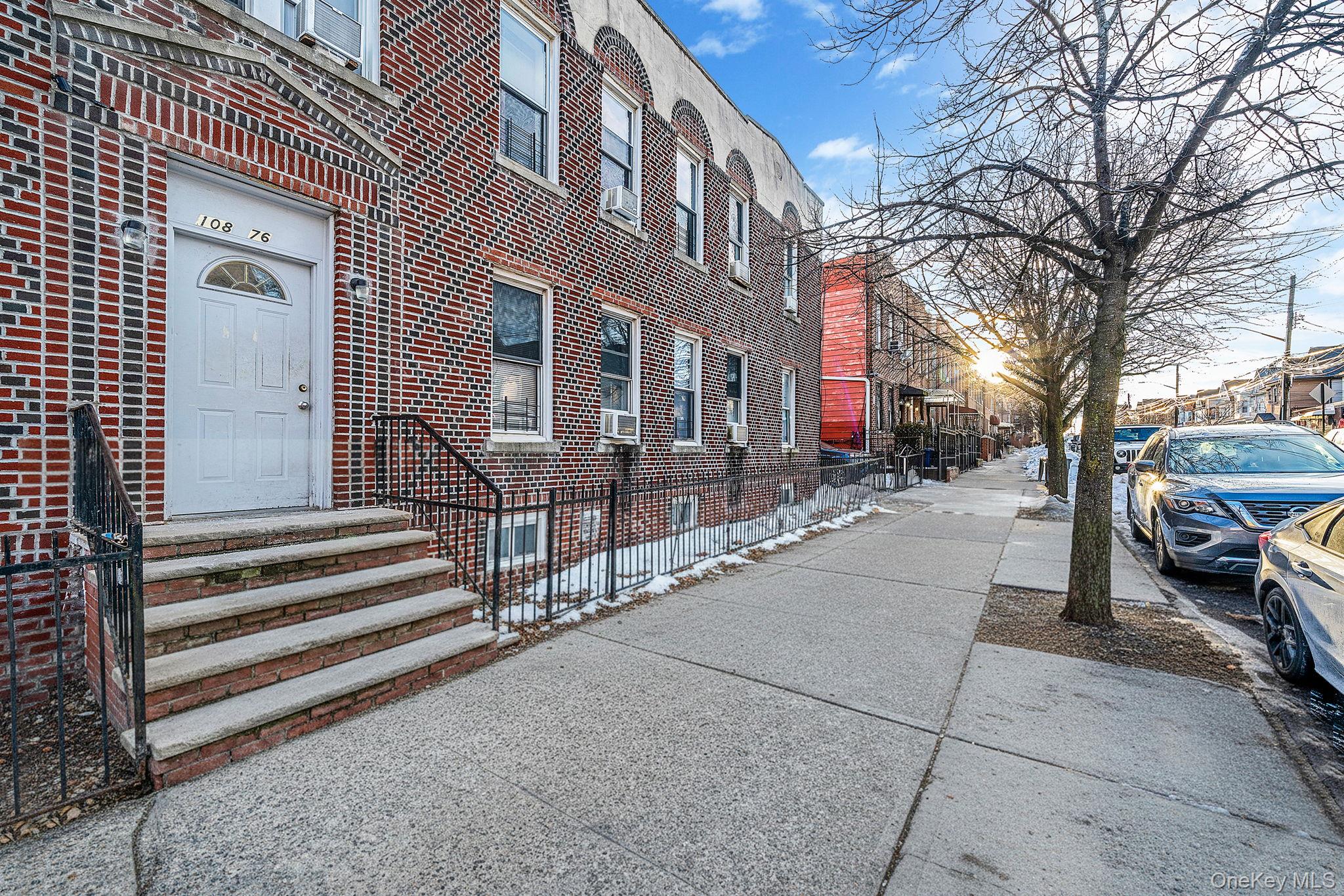 108-76 38th Avenue Queens, NY 11368 - Photo 2 of 38 a view of a building with cars parked on the road