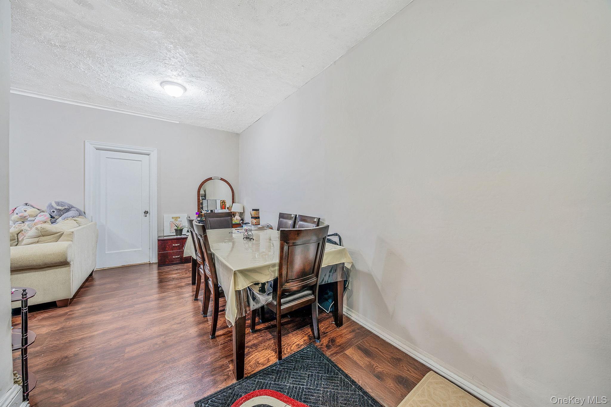 108-76 38th Avenue Queens, NY 11368 - Photo 27 of 38 a view of a workspace with furniture and bathroom