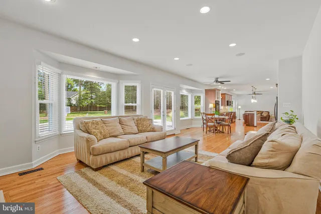 a view of an empty room with a fireplace and a window