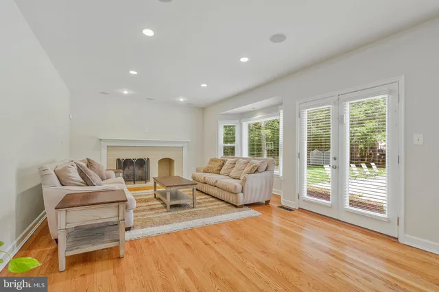 a bathroom with a granite countertop sink a mirror and a shower