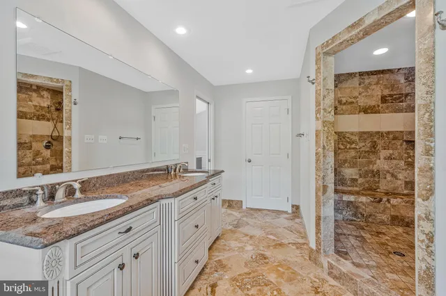 a bedroom with a bed and a lamp