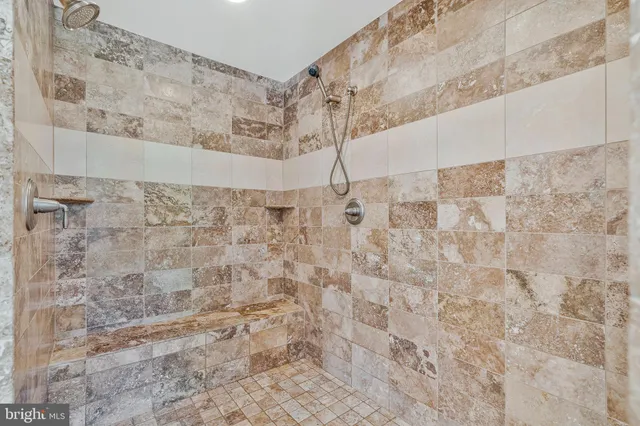 a bathroom with a shower and a tub