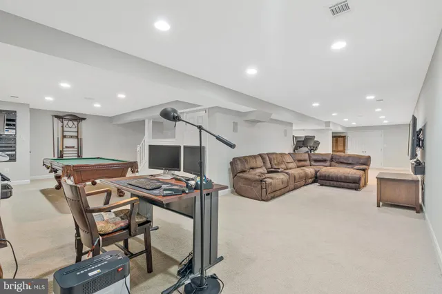 a front view of a house with a yard table and chairs
