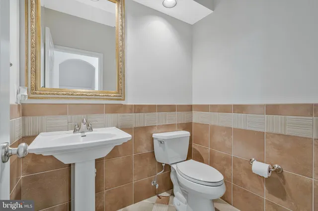 a living room with furniture a wooden floor and next to a window