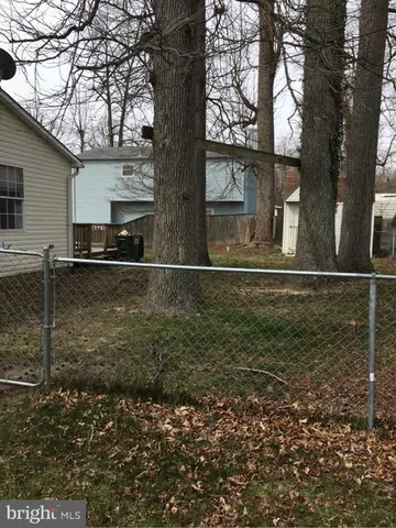 a house with trees in the background