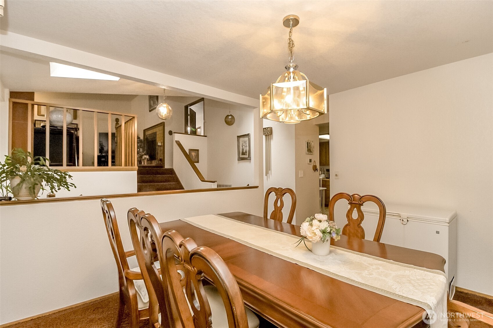 22121 4th Avenue Southeast Bothell, WA 98021 - Photo 8 of 22 a view of a dining room with furniture and a chandelier