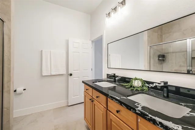 a bedroom with a bed and a lamp