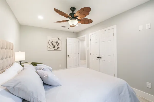 a bathroom with a shower and a glass door