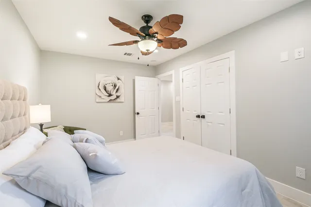a bathroom with a shower and a glass door