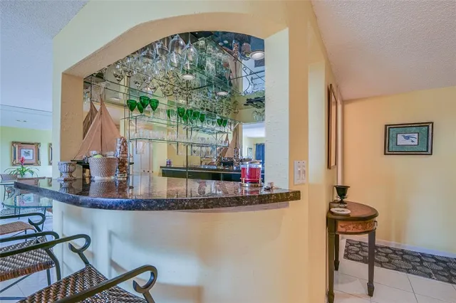 a kitchen with a white stove top oven and cabinets