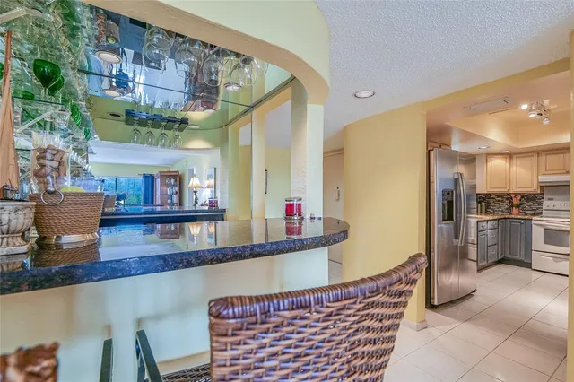 a kitchen with a stove top oven and cabinets