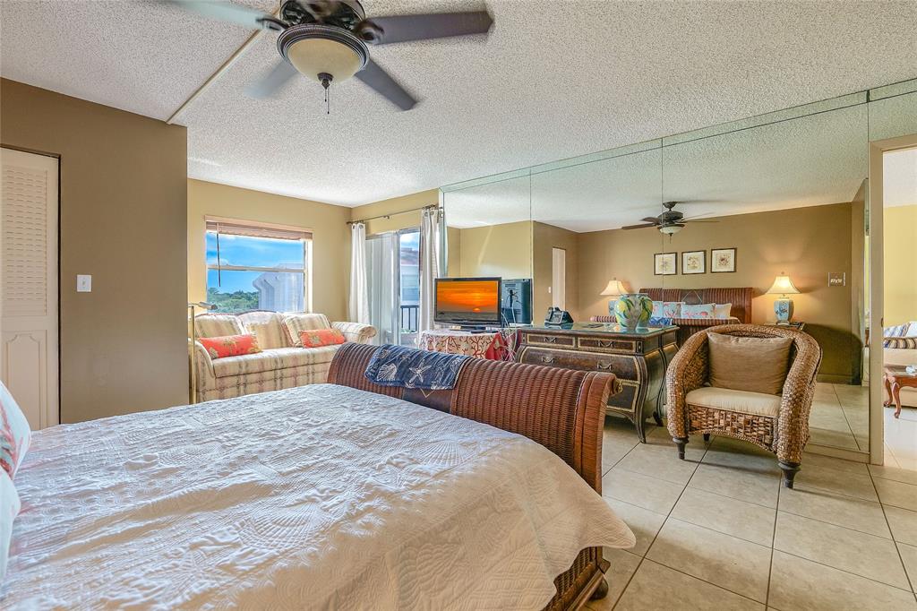 3930 Inverrary Boulevard, Unit 608D Lauderhill, FL 33319 - Photo 21 of 65 a bedroom with furniture and a window