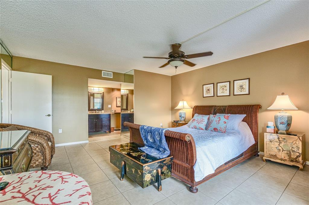 3930 Inverrary Boulevard, Unit 608D Lauderhill, FL 33319 - Photo 22 of 65 a spacious bedroom with a bed a couch and dresser