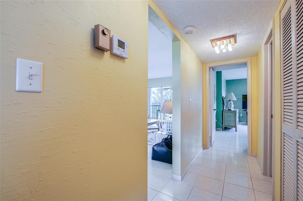 3930 Inverrary Boulevard, Unit 608D Lauderhill, FL 33319 - Photo 34 of 65 a view of a hallway with bathroom and a sink
