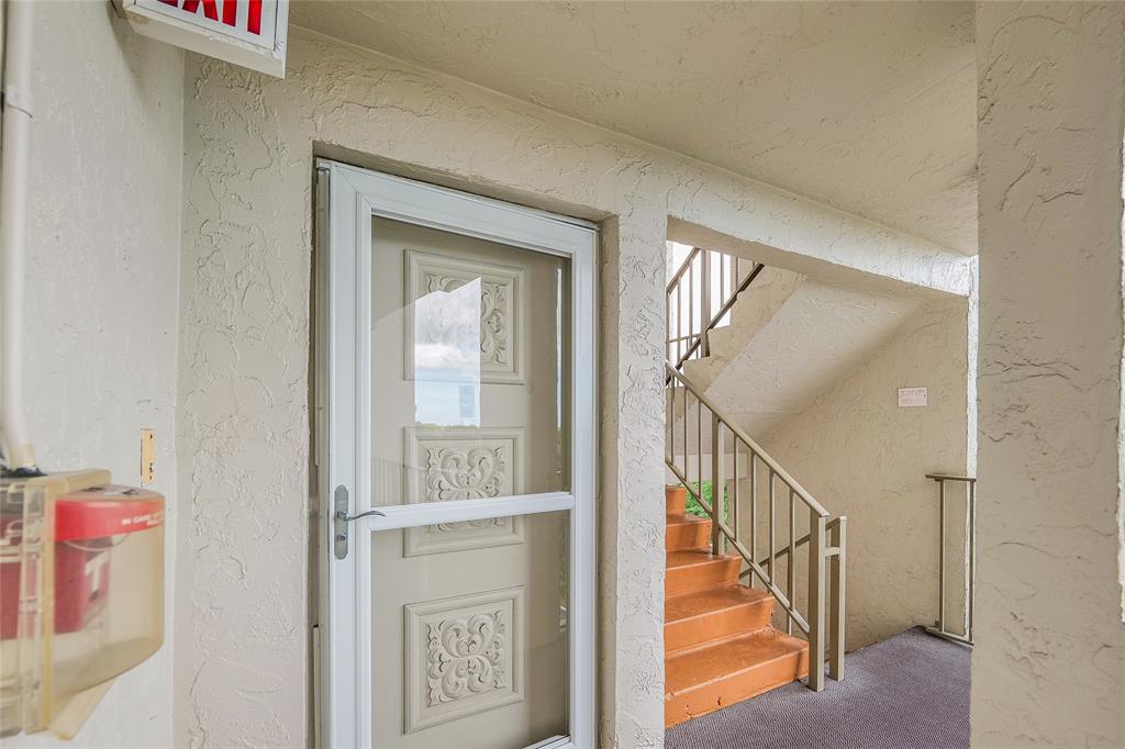 3930 Inverrary Boulevard, Unit 608D Lauderhill, FL 33319 - Photo 37 of 65 a view of staircase with railing and white walls
