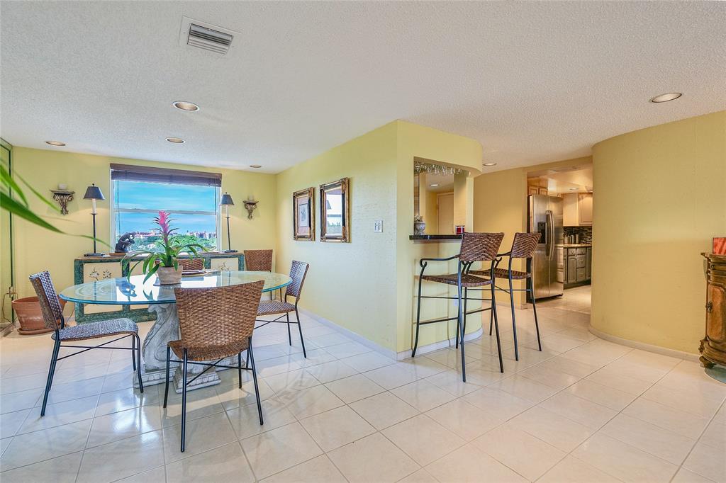 3930 Inverrary Boulevard, Unit 608D Lauderhill, FL 33319 - Photo 9 of 65 a dining room with furniture and wooden floor