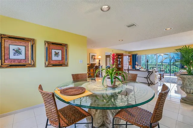 a kitchen with stainless steel appliances kitchen island granite countertop a refrigerator and a stove