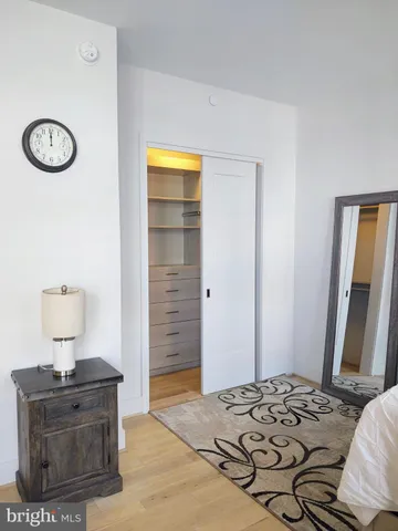 a view of room with window and wooden floor