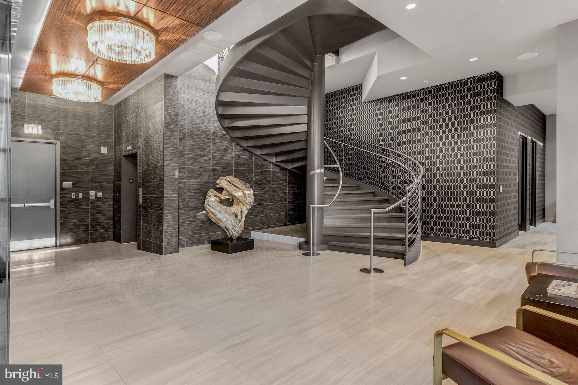 45 Sutton Square Southwest, Unit 1112 Washington, DC 20024 - Photo 34 of 46 Striking spiral staircase to the gym & Yoga Studio