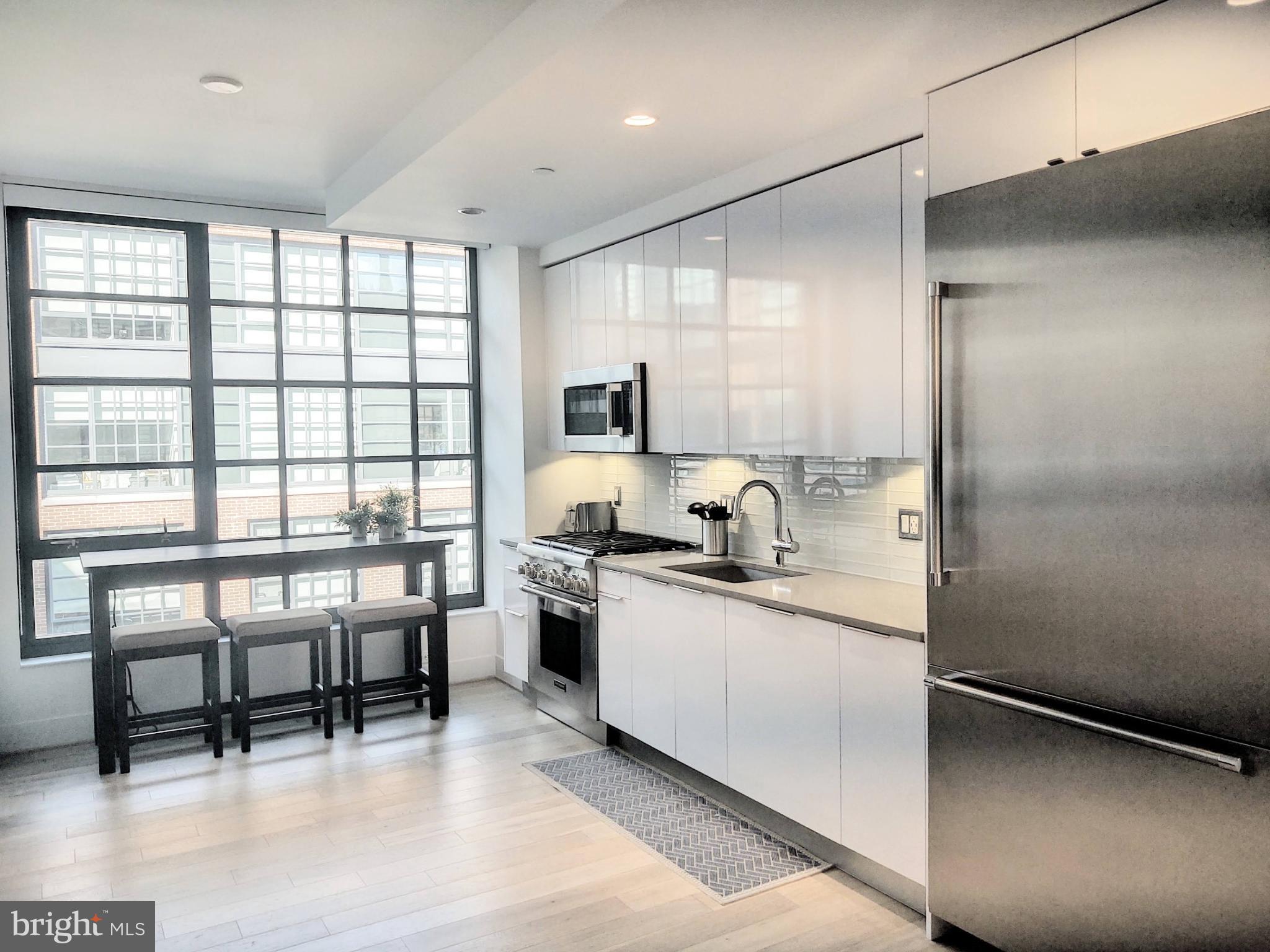 45 Sutton Square Southwest, Unit 1112 Washington, DC 20024 - Photo 6 of 46 Sleek modern kitchen with abundant light.