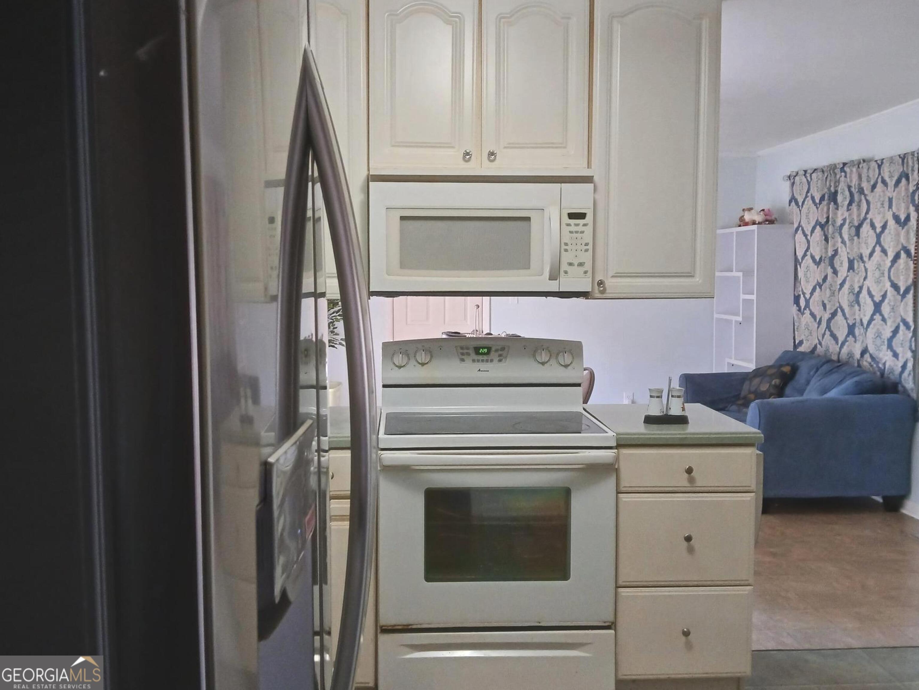 242 Lake Jodeco Road Jonesboro, GA 30236 - Photo 28 of 71 kitchen view to living/dining room combo
