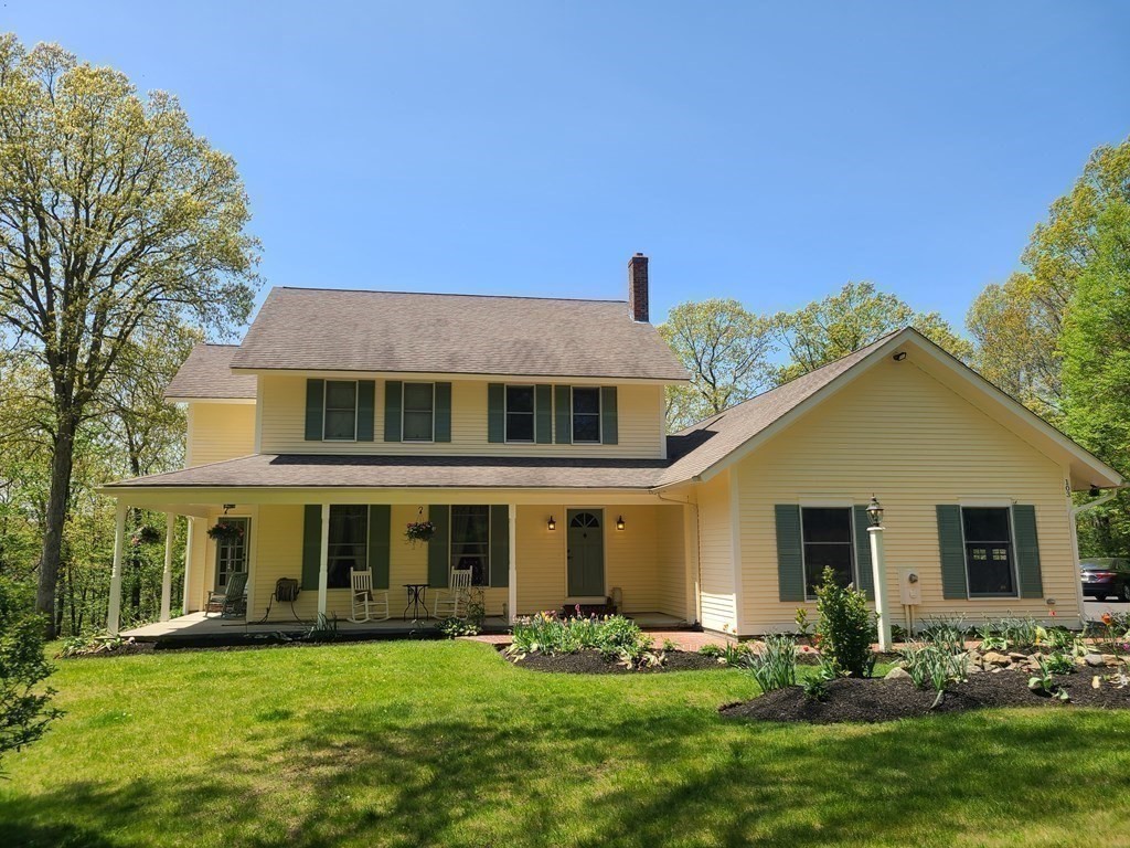 103 Burbank Road Sutton, MA 01590 - Photo 1 of 36 a front view of a house with a yard