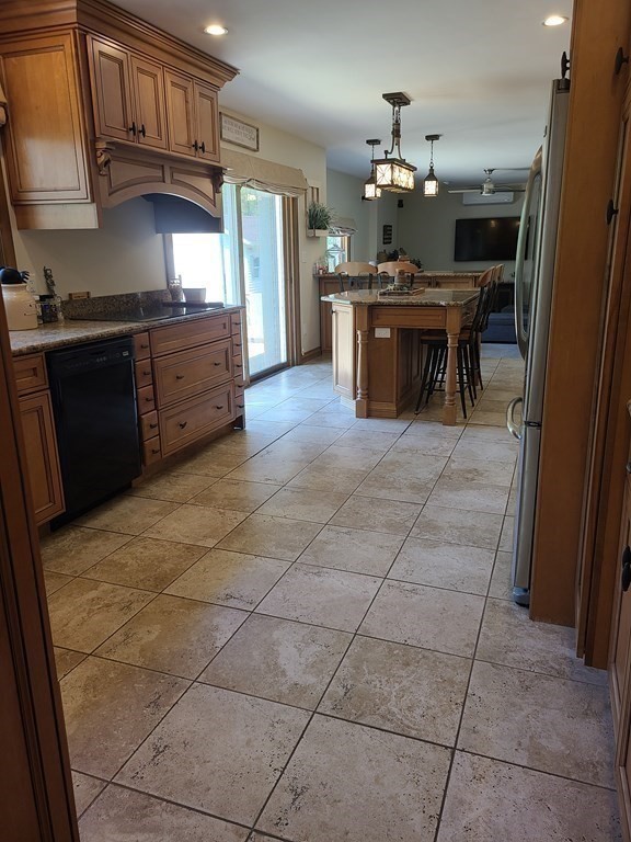 103 Burbank Road Sutton, MA 01590 - Photo 11 of 36 a kitchen with stainless steel appliances a sink stove and cabinets