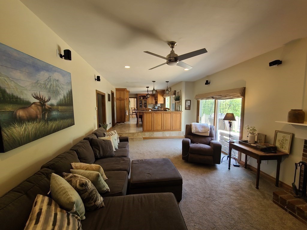 103 Burbank Road Sutton, MA 01590 - Photo 13 of 36 a living room with furniture and a flat screen tv