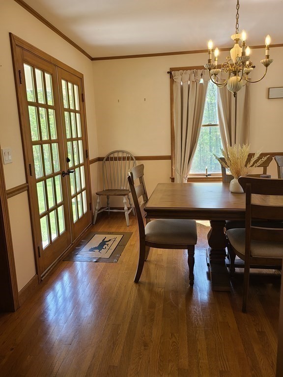 103 Burbank Road Sutton, MA 01590 - Photo 16 of 36 a view of a livingroom with furniture wooden floor and windows