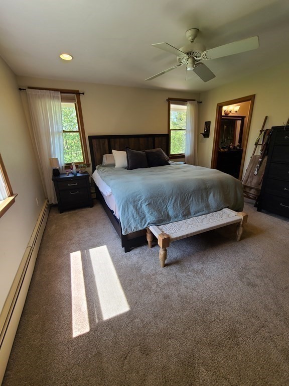 103 Burbank Road Sutton, MA 01590 - Photo 19 of 36 a bedroom with a bed and a balcony view