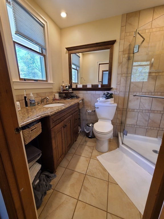 103 Burbank Road Sutton, MA 01590 - Photo 21 of 36 a bathroom with a toilet sink and mirror