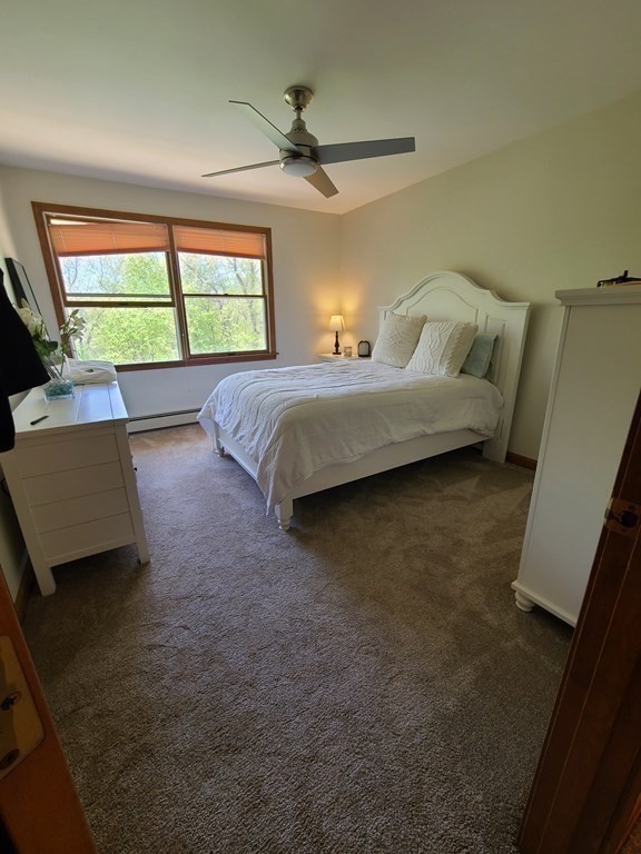 103 Burbank Road Sutton, MA 01590 - Photo 23 of 36 a bedroom with a bed and a window