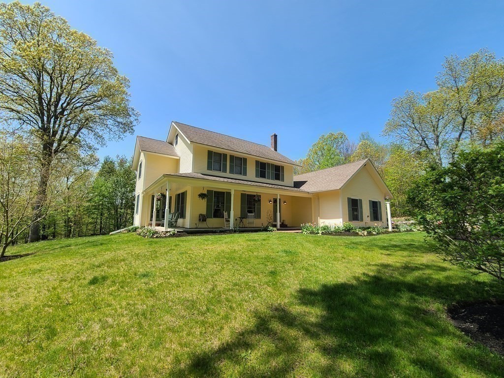 103 Burbank Road Sutton, MA 01590 - Photo 3 of 36 a front view of a house with a yard