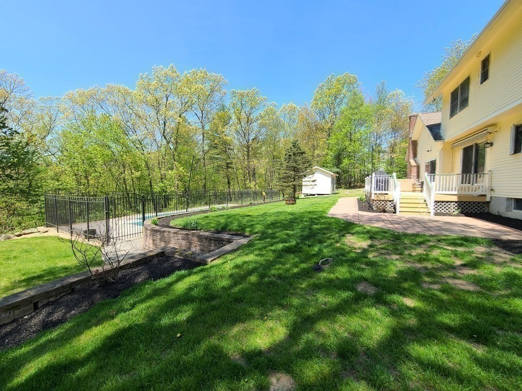 103 Burbank Road Sutton, MA 01590 - Photo 31 of 36 a view of a backyard with sitting area