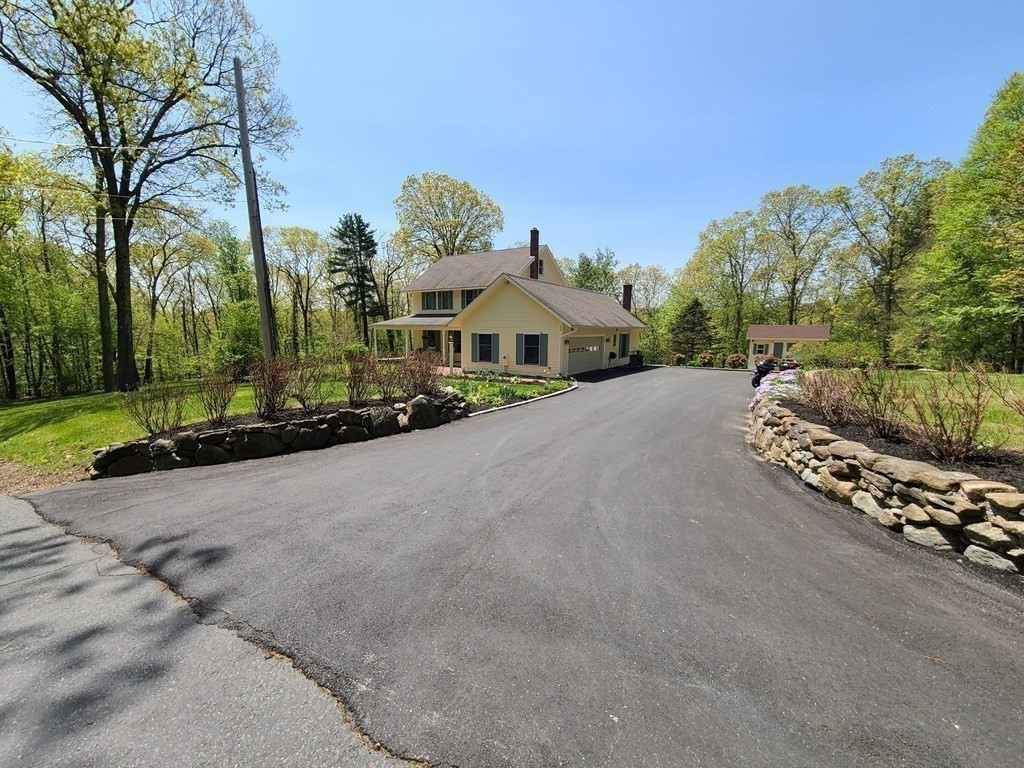 103 Burbank Road Sutton, MA 01590 - Photo 4 of 36 a view of a house with a street