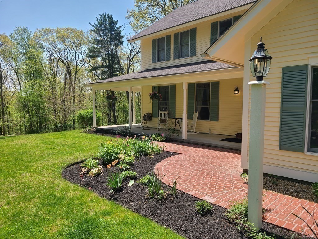 103 Burbank Road Sutton, MA 01590 - Photo 7 of 36 a view of a house with yard and a garden