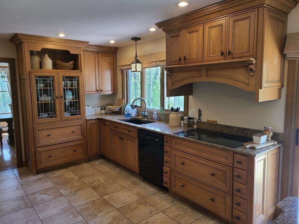 103 Burbank Road Sutton, MA 01590 - Photo 10 of 36 a kitchen with granite countertop a refrigerator stove and sink